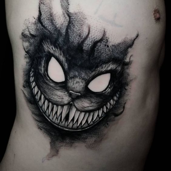 Ink madness in as 15 dark Cheshire Cat tattoos