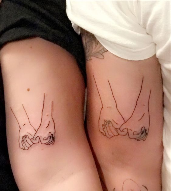 Friends bicep pinky promise tattoo