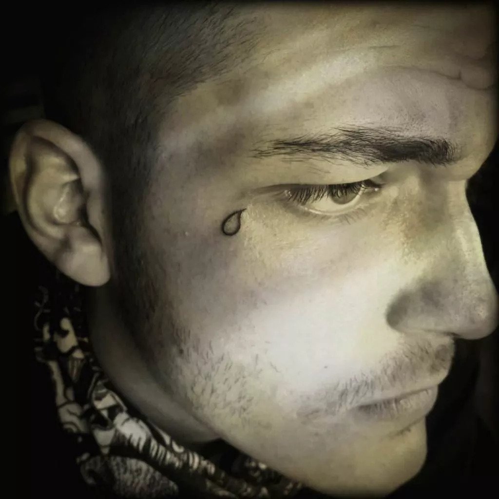 One tear tattoo