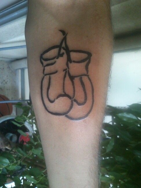 Simple boxing gloves tattoos: A symbol of strength and resilience