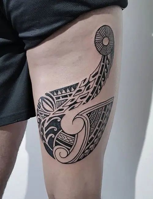 Intricate Maori fish hook tattoo design emphasizing its symbolism of strength and determination.