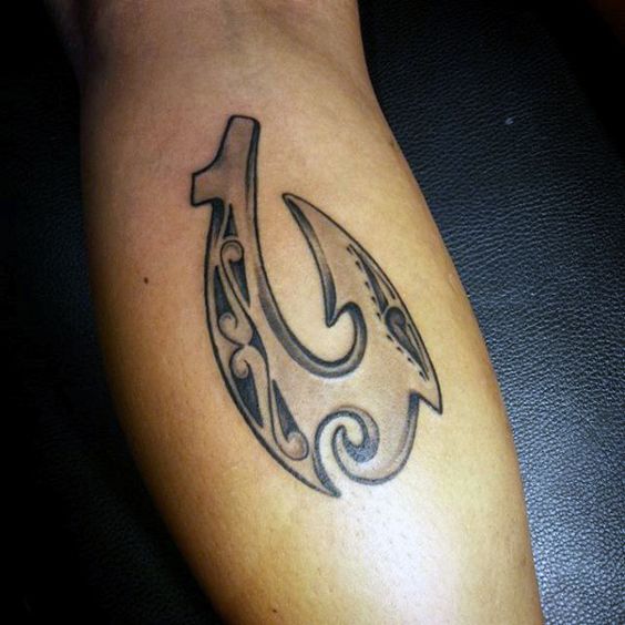 Artistic fish hook tattoo forearm design capturing the essence of strength and determination.