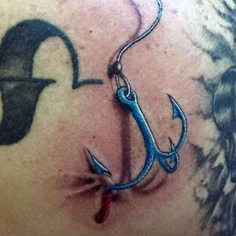 Bold fish hook tattoo design symbolizing the duality of strength and determination.