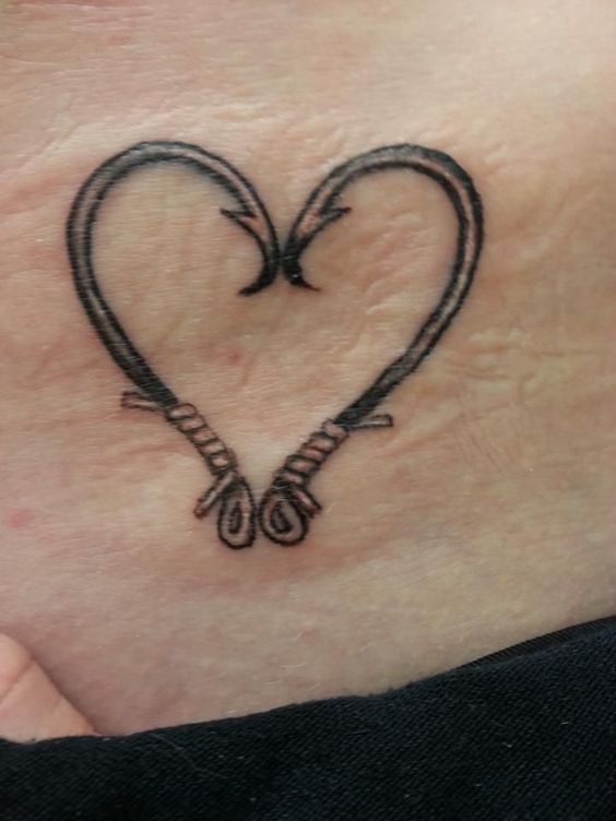 Heart fish hook tattoo design, symbolizing the simplicity and directness of the symbol.