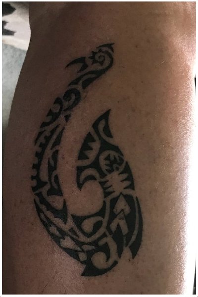 Polynesian fish hook tattoo design emphasizing its symbolism of strength and resilience.