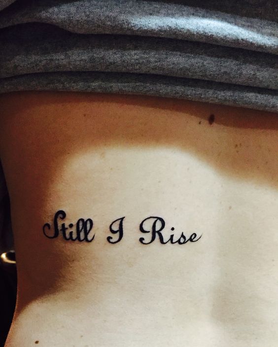 Graceful 'Still I Rise' back tattoo artwork, representing the journey of rising above adversities and challenges with grace and determination.