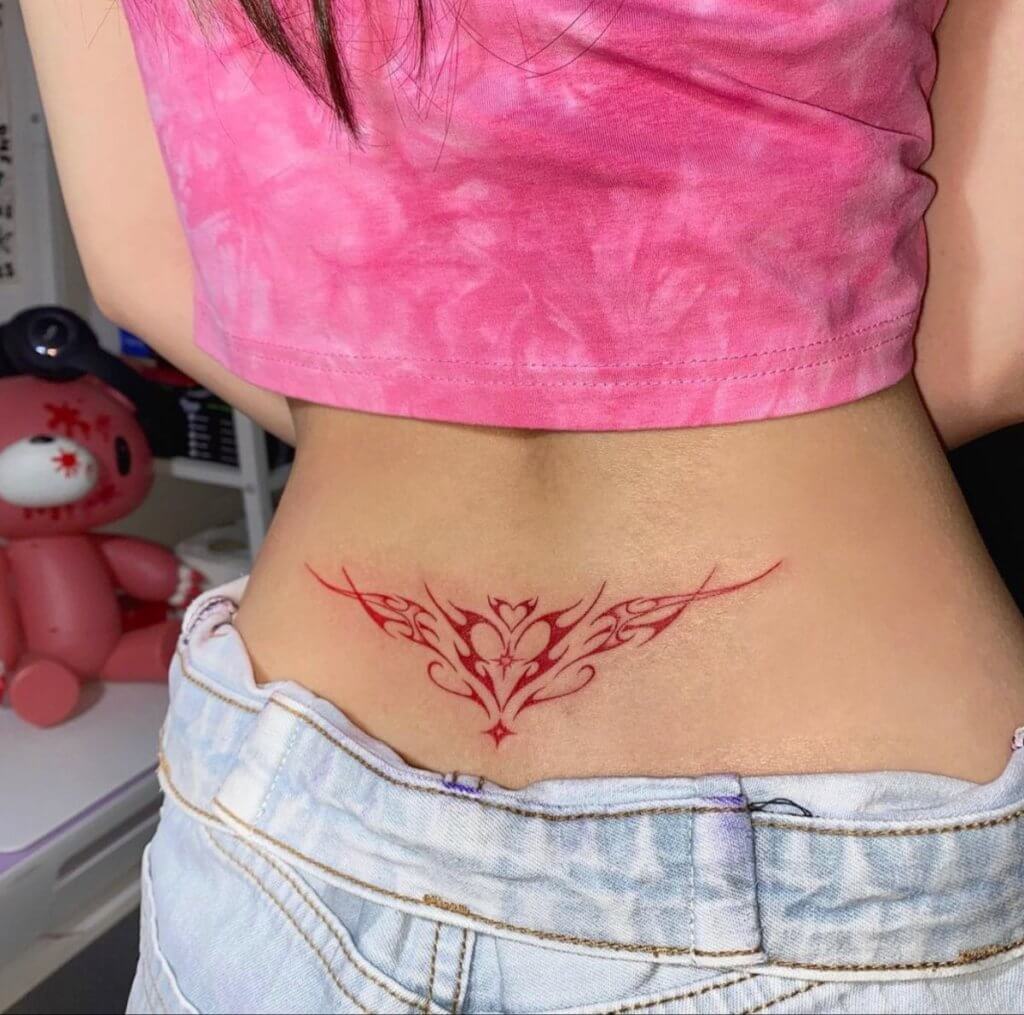 lower back pink succubus tattoo
